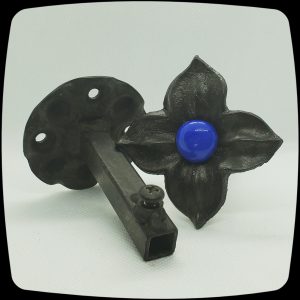 Item # 588M - Unique Floral Drapery Medallion Embellished with an Opaque Cobalt Blue Glass Stone - 3" Diagonal